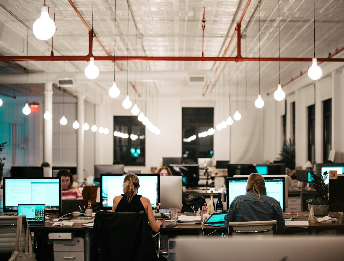 An open-plan office with people working at desks
