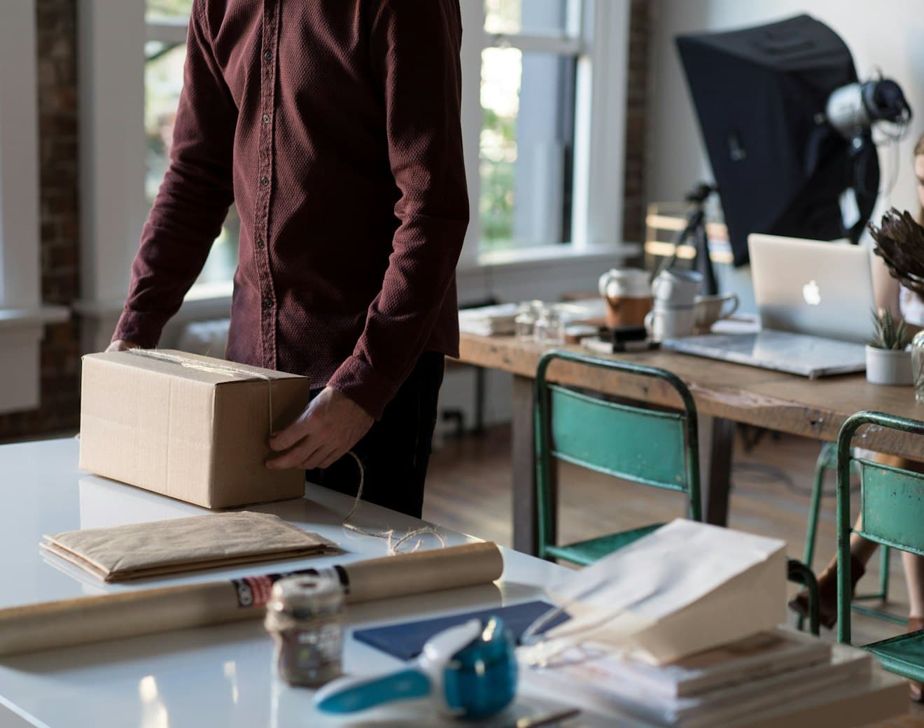 A small business owner packing online orders