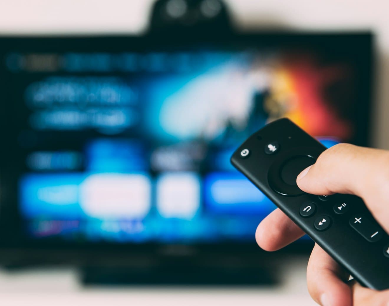 Someone browsing a streaming service on a television