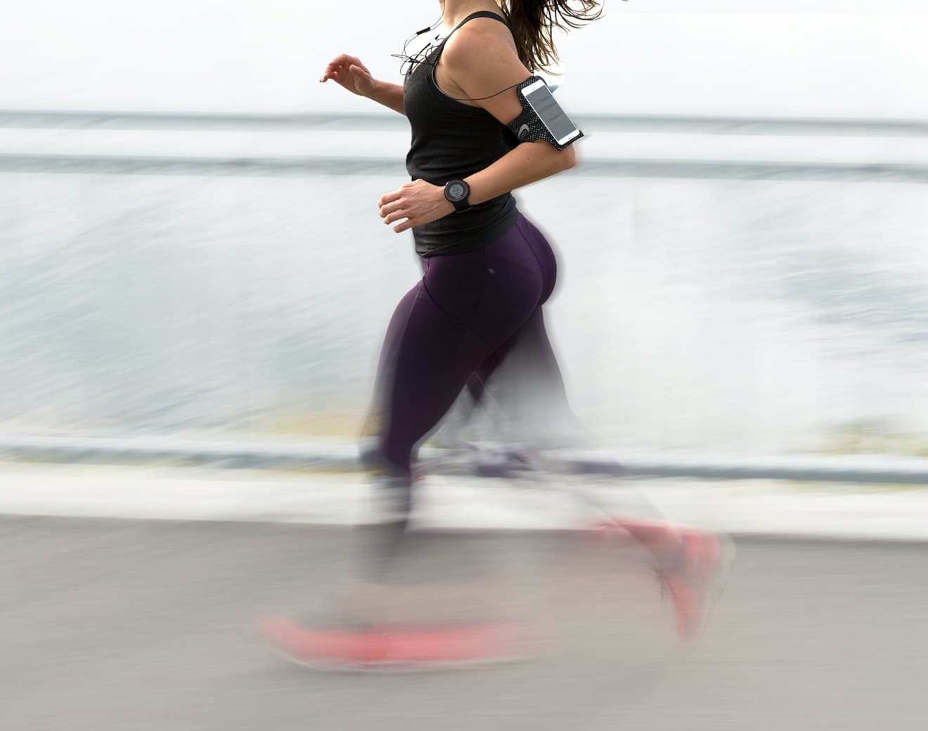 A runner tracking a workout with a fitness device