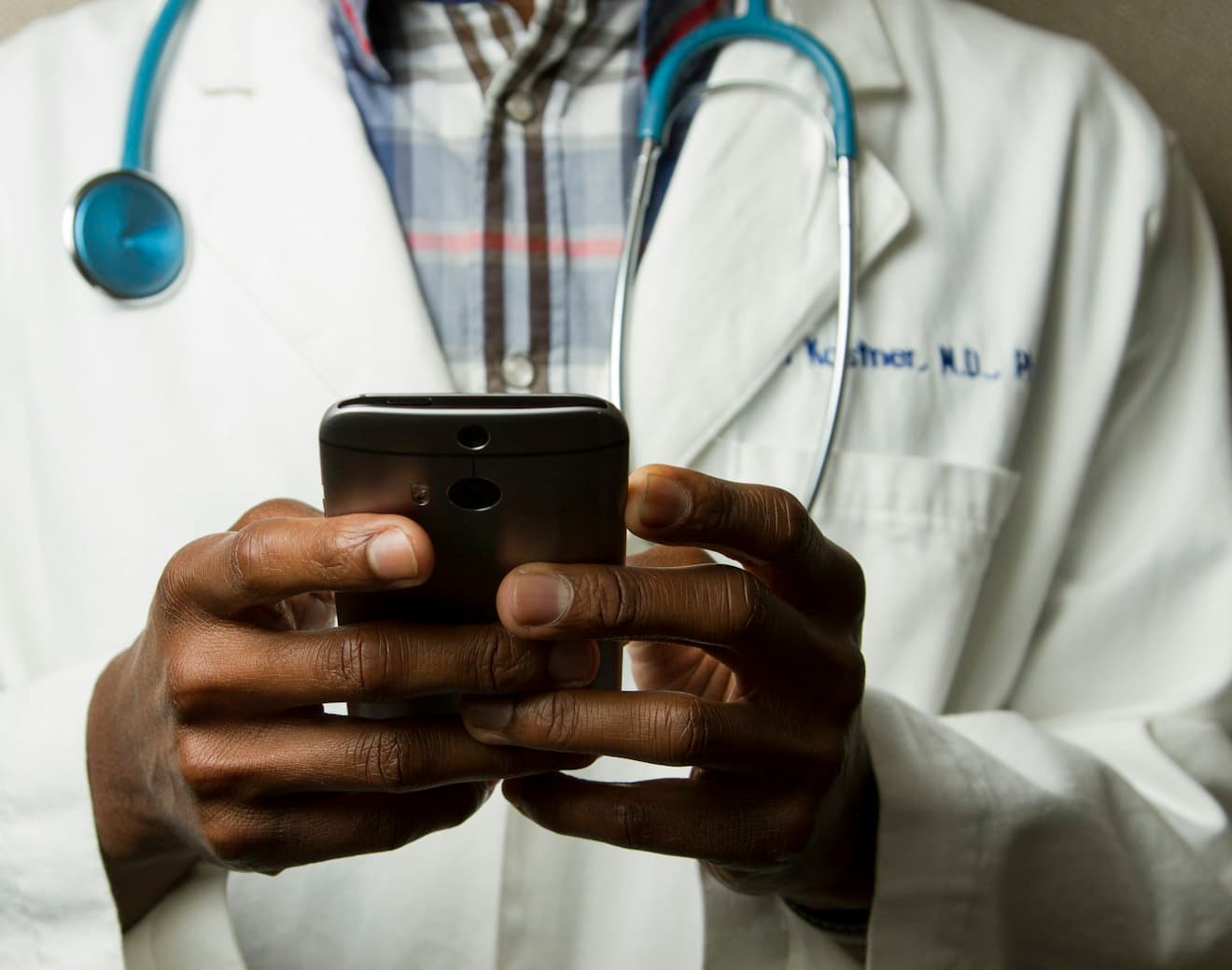 A clinician using a smartphone