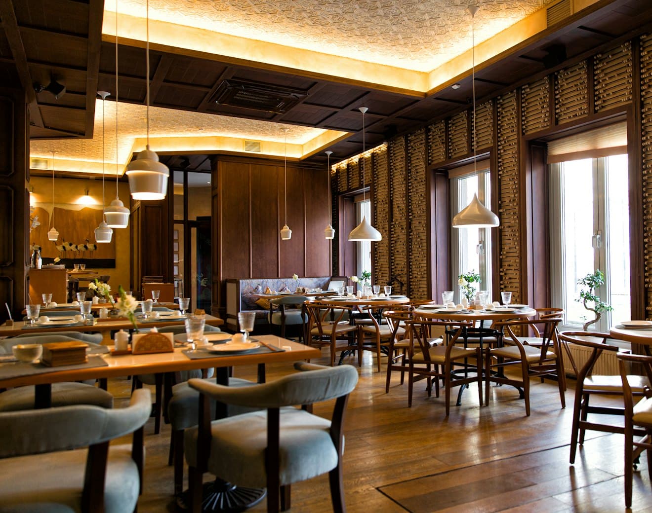 A warmly lit restaurant dining room