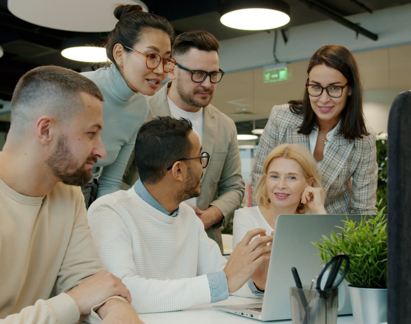 A team reviewing work together in an office