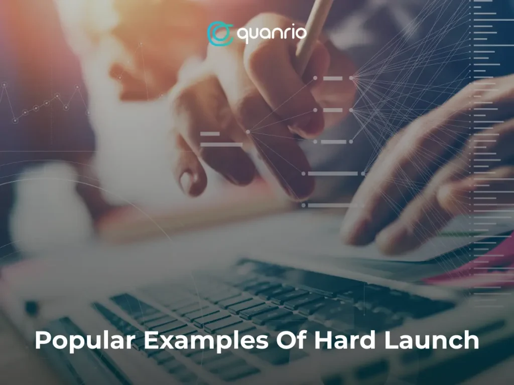 Hands typing on a laptop with text 'Popular Examples Of Hard Launch' and 'quanrio' logo overlaid on the screen.